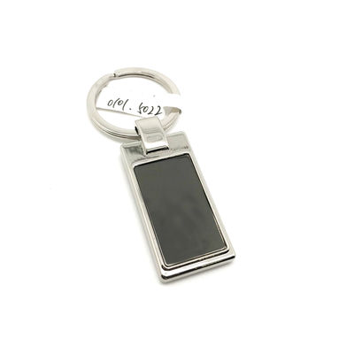 Porte-clés en métal en argent avec OEM/ODM disponible pour le nom