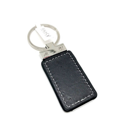 Porte-clés en cuir classique avec motif personnalisé emballé dans un polybag