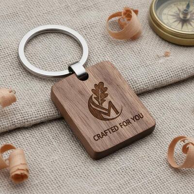 Bon prix Logo personnalisé porte-clés en bois gravé artisanat personnalisable et porte-clés en métal conçu pour une commercialisation unique en ligne